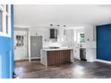 Bright, open kitchen with an island and stainless steel appliances at 8420 Sheridan Dr, Jonesboro, GA 30236