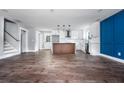 Kitchen offers stainless appliances, island and views into the living space at 8420 Sheridan Dr, Jonesboro, GA 30236