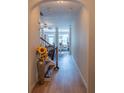 Inviting entryway featuring wood floors and an archway leading to the dining area at 961 Pierce Ivy Ct, Lawrenceville, GA 30043