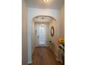 Welcoming entryway with wood floors and an archway to the back door at 961 Pierce Ivy Ct, Lawrenceville, GA 30043