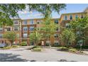 Exterior view of a stucco and brick building with manicured landscaping and a well-maintained parking area at 10 Perimeter Summit Ne Blvd # 4243, Brookhaven, GA 30319