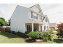 Two-story home with manicured landscaping, inviting porch, and neutral siding at 258 Creek View Ln, Acworth, GA 30102