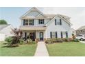 Inviting two-story home with blue shutters, stone accents, and a cozy front porch at 258 Creek View Ln, Acworth, GA 30102