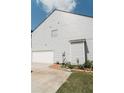 Attached garage with ample parking space and a well-maintained exterior at 258 Creek View Ln, Acworth, GA 30102