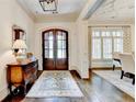 Elegant foyer boasts hardwood floors, a stylish rug, and views into the dining room at 272 Lake Forrest Ne Ln, Atlanta, GA 30342