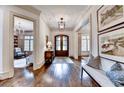 Grand foyer showcases hardwood floors, detailed trim, and access to the living spaces at 272 Lake Forrest Ne Ln, Atlanta, GA 30342