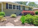 Landscaped front yard with stone walkway leading to a cozy home with an updated exterior at 2985 Westbury Dr, Decatur, GA 30033