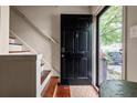 Inviting front door with keyless entry and hardwood floors at the foyer at 136 Peachtree Memorial Nw Dr # Nh4, Atlanta, GA 30309