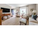 Bright living room featuring hardwood floors, bay window, and neutral decor at 136 Peachtree Memorial Nw Dr # Nh4, Atlanta, GA 30309