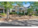 Lovely two-story home with a stone facade, a covered porch, and landscaped front yard at 4845 Backbay St, Suwanee, GA 30024