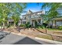 Beautifully landscaped two-story home with a stone facade and a welcoming front porch at 4845 Backbay St, Suwanee, GA 30024