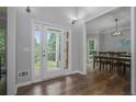 Inviting foyer with wood floors and a view of the dining room at 2482 Windchase Dr, Buford, GA 30518