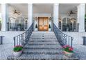 Grand entrance showcasing brick steps, black iron railings, and double doors to the house at 790 Lakeview Ne Ave, Atlanta, GA 30308