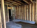 Unfinished basement awaiting transformation, featuring visible utilities at 678 Sweet Ashley Way, Loganville, GA 30052