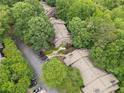 Overhead view of townhome community with lush trees and neighborhood parking at 2510 Cumberland Se Ct, Smyrna, GA 30080