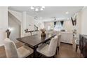 Bright and airy living room open to the dining area at 2237 Foley Park St, Snellville, GA 30078