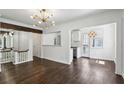 Open floor plan showcasing hardwood floors, staircase and views into the kitchen at 1072 Piedmont Ne Ave # 101, Atlanta, GA 30309