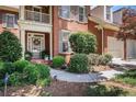 Inviting front entrance with decorative glass door and well-maintained landscaping at 1600 Heritage Trl, Roswell, GA 30075
