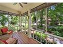 Inviting screened porch with comfortable seating overlooking a serene, wooded landscape at 4649 Dahlia Dr, Pine Lake, GA 30072