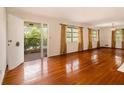 Bright living room boasts gleaming hardwood floors, natural light, and an inviting atmosphere at 894 Nottingham Dr, Avondale Estates, GA 30002
