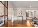 Elegant foyer with hardwood floors, white trim, and an open view to the dining and living areas at 1041 Standard Ne Dr, Brookhaven, GA 30319