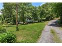 A charming house nestled in nature, with a large yard and peaceful surroundings at 128 Reynolds Bridge Rd, Kingston, GA 30145