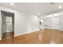 Spacious living room with hardwood floors and bright, open layout to the kitchen and bath at 163 Oakcliff Ct, South Fulton, GA 30331