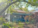 Quaint home featuring a covered porch, inviting entryway, and lovely landscaping, perfect for relaxation and curb appeal at 23 Gould Se St, Atlanta, GA 30315