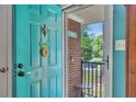Inviting front door with a vibrant turquoise finish, complete with a 'Welcome' sunflower at 3761 Lindley Cir, Powder Springs, GA 30127
