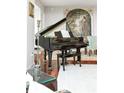 Elegant living room showcasing a grand piano, hardwood floors, and stylish decor at 2795 Peachtree Ne Rd # 2101, Atlanta, GA 30305