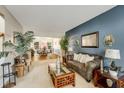 Cozy living room featuring a decorative fireplace, stylish furnishings, and ample natural light at 6378 Grey Fox Way, Riverdale, GA 30296