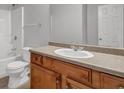 Bathroom featuring a sink with wooden cabinetry and a shower over tub at 4115 Kensington Cv, Atlanta, GA 30349