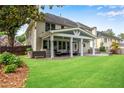 Beautiful backyard with patio, outdoor seating area, and well-maintained lawn at 2500 Madison Commons, Atlanta, GA 30360