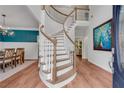 Elegant foyer with a winding staircase, hardwood floors, and stylish decor at 2500 Madison Commons, Atlanta, GA 30360
