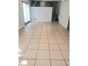 Spacious living room featuring tiled floors, sliding glass doors, and access to the staircase at 4274 Carrollwood Dr, Stone Mountain, GA 30083
