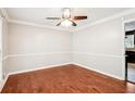 Bright dining room with hardwood floors and crown molding at 5141 Rocky Run, Stone Mountain, GA 30088