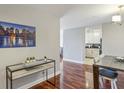 Bright dining area with hardwood floors, modern lighting, and artwork enhancing the ambiance at 195 14Th Ne St # 1706, Atlanta, GA 30309
