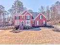 Attractive brick home with a tidy front yard, black shutters, and a classic architectural design at 4213 Bretdale Nw Run, Kennesaw, GA 30152
