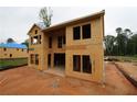 Exterior view of a home under construction, showcasing the wood framing and window openings at 4740 Briscoe Drive, Cumming, GA 30028