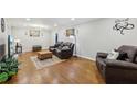 Inviting living room featuring hardwood floors, recessed lighting, and a comfortable seating area at 5222 Skyline Dr, Stone Mountain, GA 30083