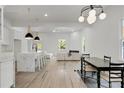 Bright open-concept living area showcasing a modern kitchen and cozy fireplace at 481 Glenwood Se Ave, Atlanta, GA 30312