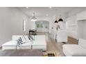 Open-concept living room featuring modern decor and seamless flow to the kitchen at 481 Glenwood Se Ave, Atlanta, GA 30312