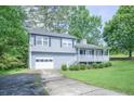 Beautiful split level home with a garage, front porch, and lovely landscaping at 2650 Montego Dr, Buford, GA 30519