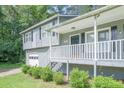 View of the home's front porch, showing the house number and a glimpse of the front yard at 2650 Montego Dr, Buford, GA 30519