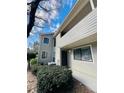 Desirable two-story condo showcasing tidy landscaping and a private covered deck at 3432 Ivys Walk, Atlanta, GA 30340