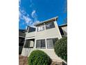 Attractive condo building boasting a covered deck and well-maintained grounds at 3432 Ivys Walk, Atlanta, GA 30340