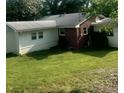 Backyard view of home featuring a well-maintained lawn at 3629 Centerview Dr, Marietta, GA 30066