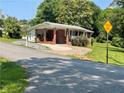 Charming single-story brick home with a covered porch, driveway, and well-maintained landscaping at 3629 Centerview Dr, Marietta, GA 30066