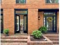 Close up of the front doors with black trim and mature landscaping at 4411 Paces Battle Nw, Atlanta, GA 30327