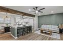 Open-concept kitchen and living area featuring a large island with seating and modern finishes with eat in table at 2378 Green Forrest Dr, Decatur, GA 30032
